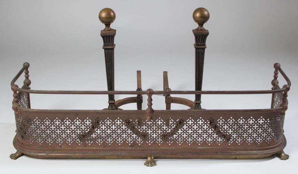 BRASS AND IRON FIREPLACE EQUIPMENT, LOT OF THREE: BRASS AND IRON FIREPLACE EQUIPMENT, LOT OF THREE, comprising a pair of andirons and a fire fender. First quarter 20th century. 21" H, 41" W. Provenance: From the Iverness Estate, Gordonsville, Virgini
