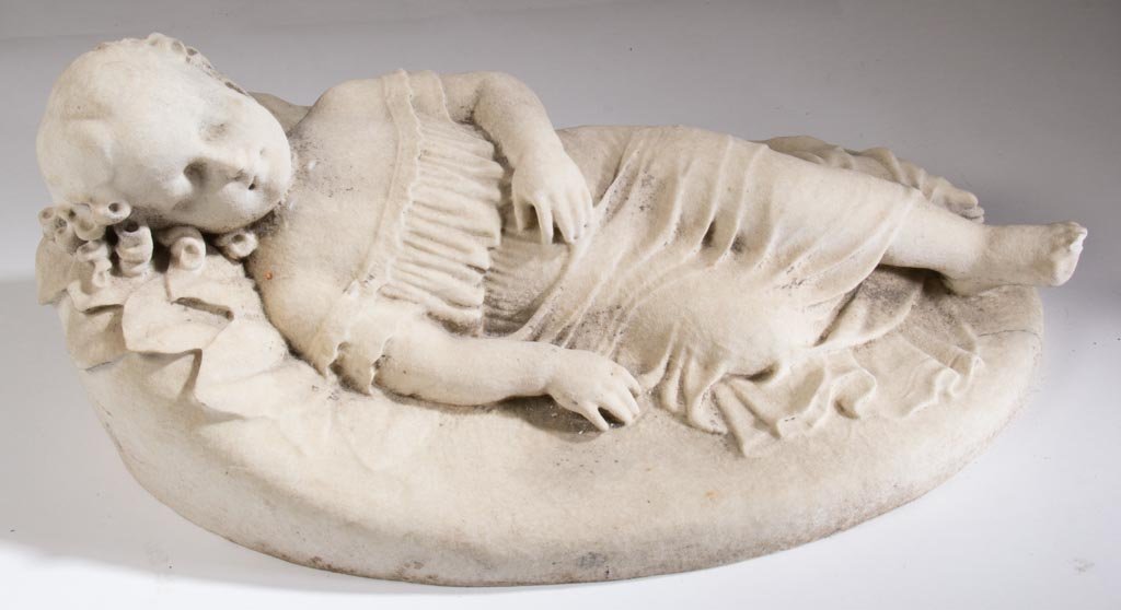 AMERICAN OR EUROPEAN CARVED STONE STATUE: AMERICAN OR EUROPEAN CARVED STONE STATUE, large example of a young sleeping girl in relief-carved form on oblong raised base. Late 19th/early 20th century. 30" WOA, 13" HOA, 18" DOA. Provenance: Colle