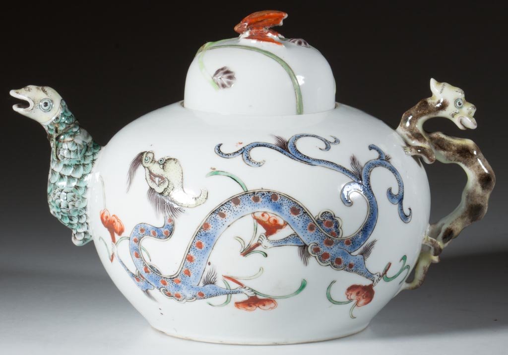 JAPANESE EDO-PERIOD ARITA PORCELAIN GLOBULAR TEAPOT AND: JAPANESE EDO-PERIOD ARITA PORCELAIN GLOBULAR TEAPOT AND DOMED COVER, with applied dragon-form handle and serpent-form spout, and red-winged bat-form finial to cover, the body sides painted with a colo
