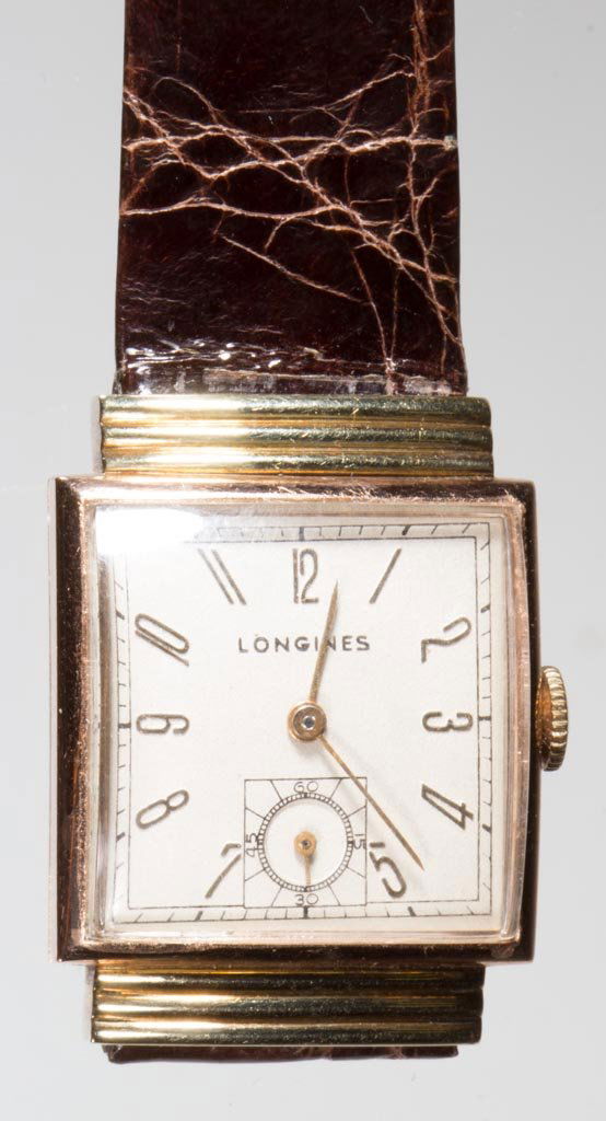 VINTAGE LONGINES 14K GOLD CASE MAN'S WRIST WATCH: VINTAGE LONGINES 14K GOLD CASE MAN'S WRIST WATCH, 17-jewel movement, serial #6479360, two-tone case marked, modern band. First half 20th century. 1" SQ case. Provenance: Collection of the late Anne Po