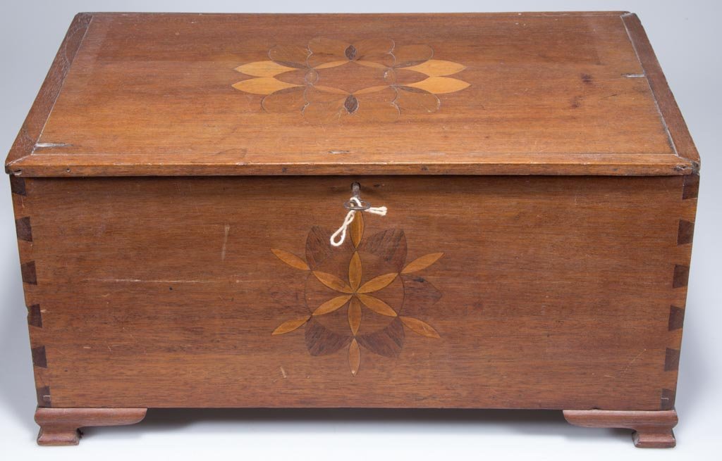 MID-ATLANTIC INLAID WALNUT BIBLE OR SEWING BOX: MID-ATLANTIC INLAID WALNUT BIBLE OR SEWING BOX, hinged lid with applied moldings, above a dovetailed case raised on ogee-molded feet. Top and front each set with a complex star and rosette inlay. Firs