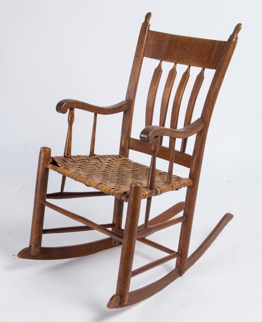 AMERICAN MIXED WOOD ROCKING CHAIR: AMERICAN MIXED WOOD ROCKING CHAIR, hybrid form with arrow-back spindles and stepped back and shaped arm rests. Possibly original splint ash seat. Mid-19th century. 35" HOA, 14" x 18 1/4" seat. Provena
