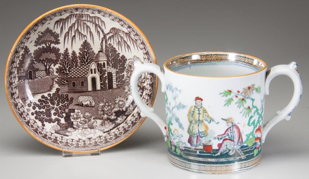 ENGLISH STAFFORDSHIRE MUG AND SAUCER: ENGLISH STAFFORDSHIRE MUG AND SAUCER, the two-handled mug "Pekin" by Bedneach and Heath with orange-lustrered bands to edges above Chinoiserie figural groups, the pearlware saucer printed with a large