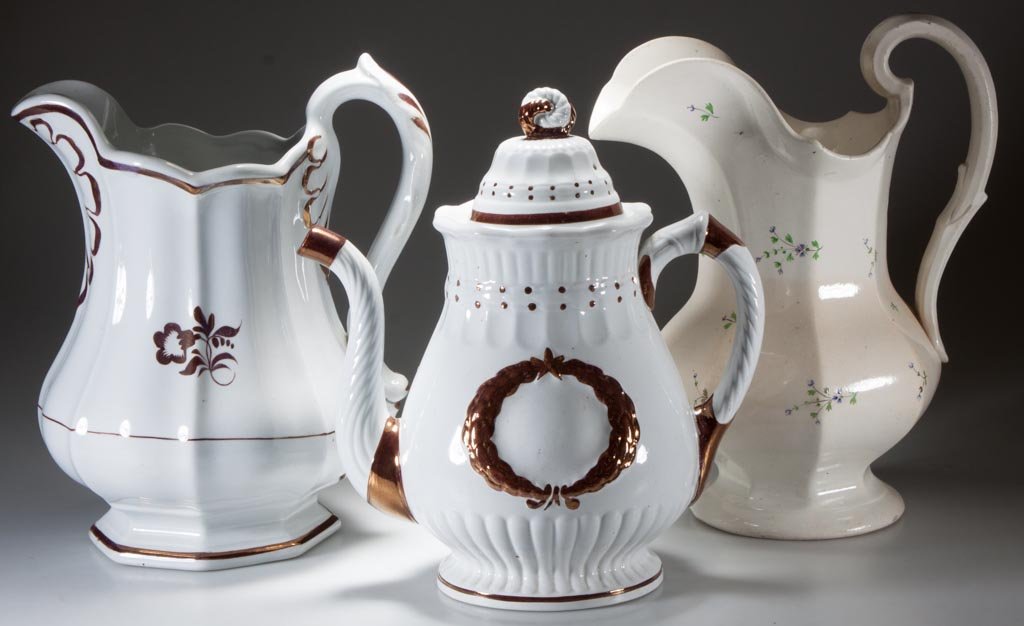 ENGLISH IRONSTONE AND POTTERY ARTICLES, LOT OF THREE: ENGLISH IRONSTONE AND POTTERY ARTICLES, LOT OF THREE, comprising two pitchers, one decorated in the tea-leaf pattern, the other a paneled salt-glazed example, decorated with Bourbon sprigs (sprigs Ang