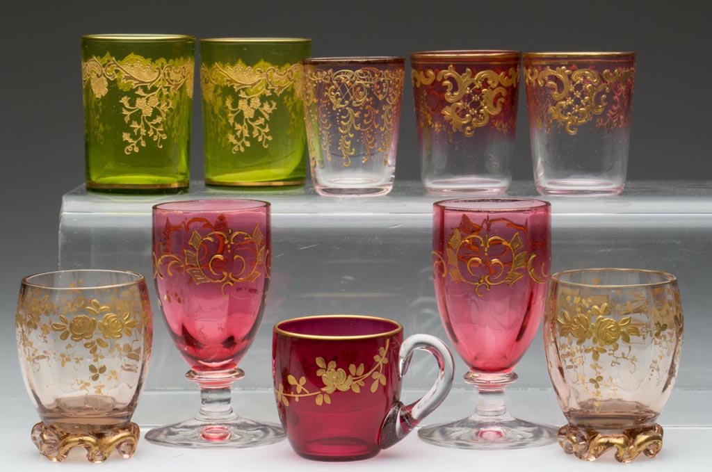 ASSORTED CONTINENTAL GILT-DECORATED LIQUOR GLASSES, LOT: ASSORTED CONTINENTAL GILT-DECORATED LIQUOR GLASSES, LOT OF TEN, various colors including cranberry and rubina, floral and neo-classical decorations, most with polished bases. France and others. Late 1
