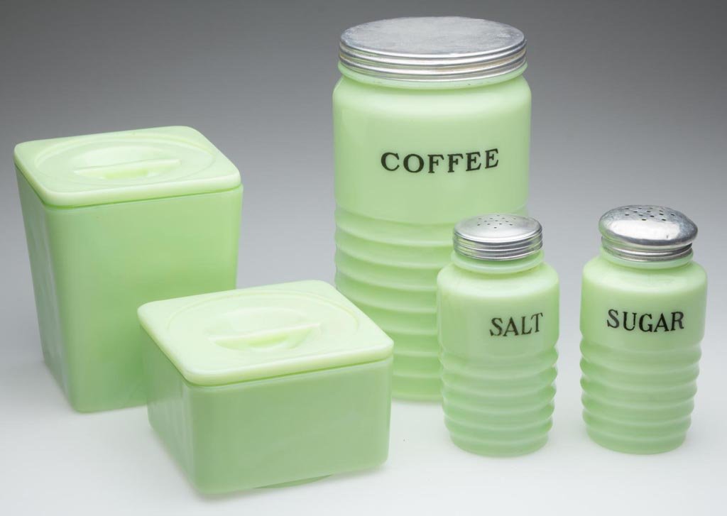 ASSORTED JADEITE KITCHEN WARE, LOT OF FIVE: ASSORTED JADEITE KITCHEN WARE, LOT OF FIVE, comprising a "Coffee" canister, "Tea" canister, "Salt" shaker, "Sugar" shaker and covered refrigerator dish. Jeanette and McKee Glass Co. First half 20th ce