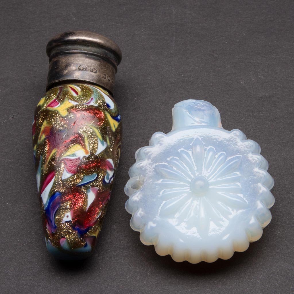 ASSORTED GLASS PUNGENT OR SCENT BOTTLES, LOT OF TWO: ASSORTED GLASS PUNGENT OR SCENT BOTTLES, LOT OF TWO, comprising a Mosaic example with goldstone and two-part Birmingham silver screw cap, and an opalescent blown-molded example. 19th and early 20th ce