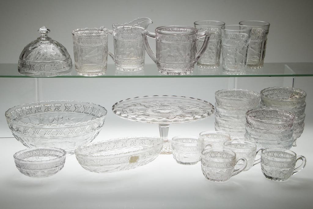 BIRD AND STRAWBERRY ARTICLES, LOT OF 27: BIRD AND STRAWBERRY ARTICLES, LOT OF 27, colorless, including a 13-piece berry set, one individual bowl, a three-piece table set, a cake stand/salver, and a butter dish cover. Early 20th century. 1 1/