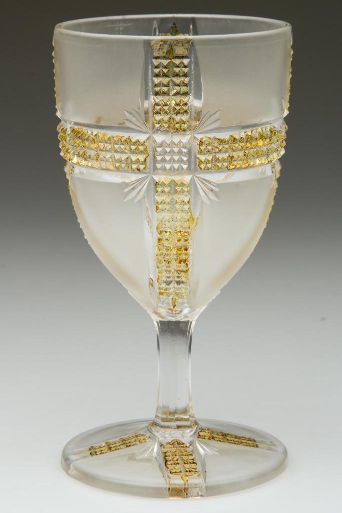 KLONDIKE / AMBERETTE - AMBER-STAINED CHAMPAGNE GLASS: KLONDIKE / AMBERETTE - AMBER-STAINED CHAMPAGNE GLASS, colorless with satin panels. Dalzell, Gilmore & Leighton Co. Circa 1898. 5 1/2" H. Provenance: The collection of the late Richard "Dick" and Mary