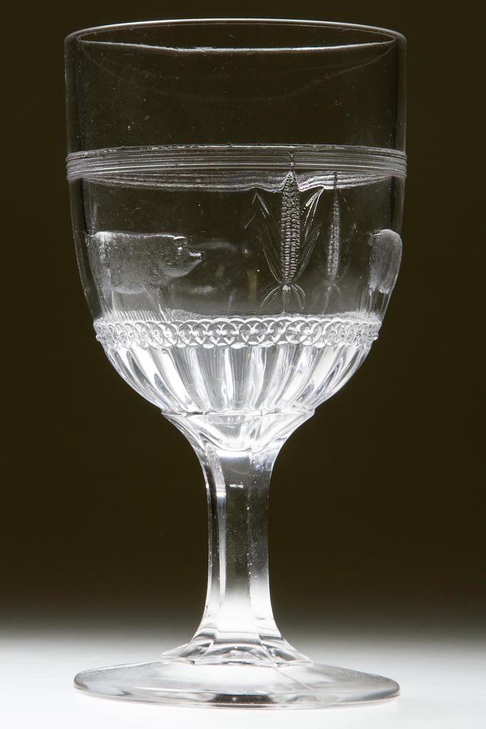 PIGS IN CORN - LEFT BENT HUSK GOBLET: PIGS IN CORN - LEFT BENT HUSK GOBLET, colorless. Fourth quarter 19th century. 5 7/8" H. Provenance: Personal collection of Judith (Judy) Cronin, Orleans, MA.