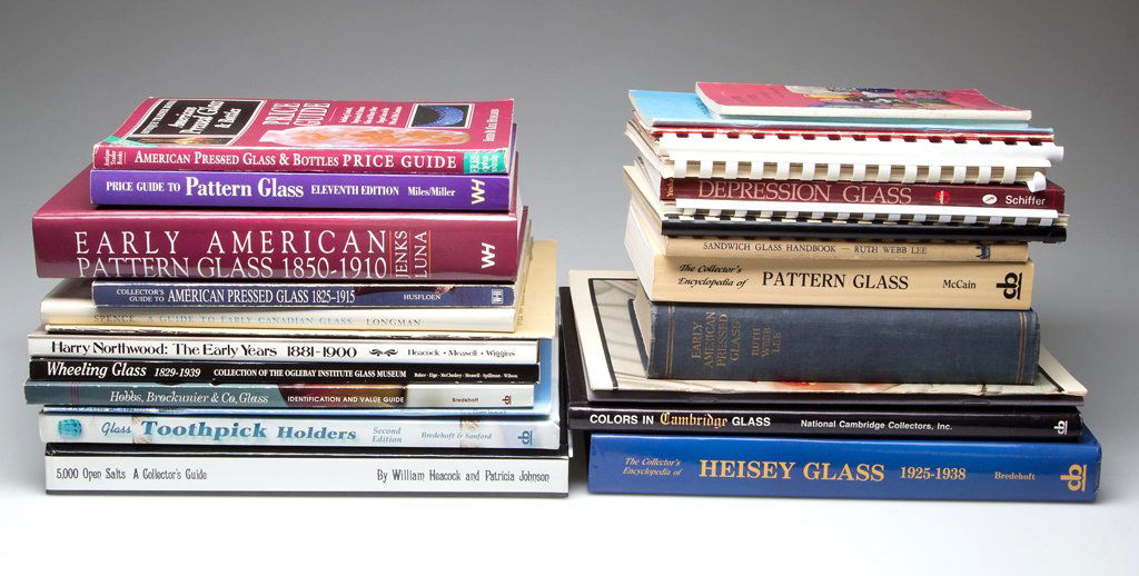 AMERICAN GLASS REFERENCE VOLUMES, LOT OF 28: AMERICAN GLASS REFERENCE VOLUMES, LOT OF 28, including Heacock/Johnson, "5,000 Open Salts"; along with volumes on toothpick holders, Heisey, EAPG, etc. Hard and soft covers. Provenance: From the colle