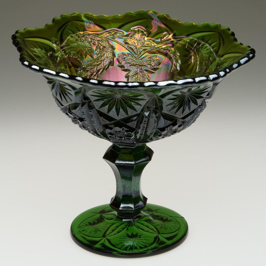 MILLERSBURG POPPY CARNIVAL GLASS COMPOTE: MILLERSBURG POPPY CARNIVAL GLASS COMPOTE, green, on high standard, with a scalloped rim. Millersburg Glass Co. First quarter 20th century. 6 3/4" H, 7 1/2" D. Provenance: From a Odenton, Maryland coll