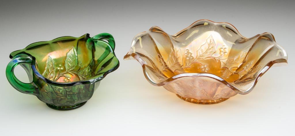 MARTINSBURG HOLLY SPRIG CARNIVAL GLASS ARTICLES, LOT OF: MARTINSBURG HOLLY SPRIG CARNIVAL GLASS ARTICLES, LOT OF TWO, comprising a green bon bon and a marigold bowl. Millersburg Glass Co. First quarter 20th century. 3" and 2 3/4" HOA, 3 3/8" x 5 3/4" and 7 