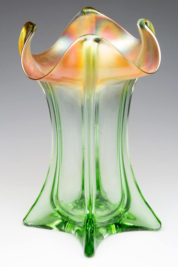 PILLAR-MOLDED CARNIVAL GLASS VASE: PILLAR-MOLDED CARNIVAL GLASS VASE, marigold on light green, square form with protruding corners and four-fold rim, factory polished under base and large pontil mark. First quarter 20th century. 10" HO