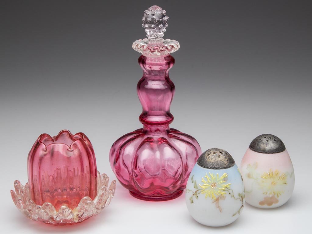 ASSORTED COLORED GLASS ARTICLES, LOT OF FOUR: ASSORTED COLORED GLASS ARTICLES, LOT OF FOUR, comprising two Mt. Washington egg salt shakers, a cranberry Fenton cologne bottle, and a cranberry rib-optic toothpick holder/rose bowl with colorless app