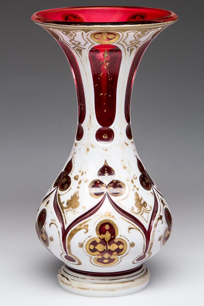 CUT DOUBLE-OVERLAY MOORISH ARCH VASE: CUT DOUBLE-OVERLAY MOORISH ARCH VASE, white to cased ruby, gilt decorations, baluster-form with low foot, polished pontil mark. Second half 19th century. 8" H.