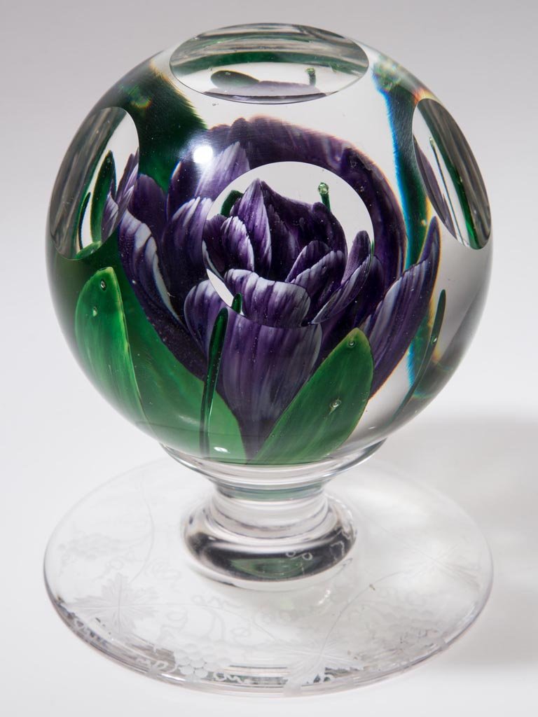 PAIRPOINT LAMPWORK PEDESTALED PAPERWEIGHT: PAIRPOINT LAMPWORK PEDESTALED PAPERWEIGHT, featuring a purple and white narcissus with four wide and four narrow green leaves, six cut windows, engraved Vintage pattern under foot, "1974 / #98" on the