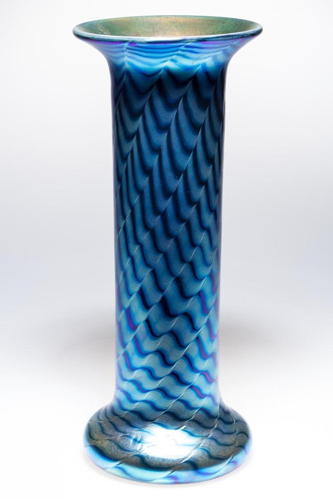 LUNDBERG STUDIOS "OCEANA" ART GLASS VASE: LUNDBERG STUDIOS "OCEANA" ART GLASS VASE, blue iridescent with gold interior, tall cylindrical form with flared base and rim, signed "Lundberg Studios, 2001, 050315" around the pontil mark. 12" H. Pro