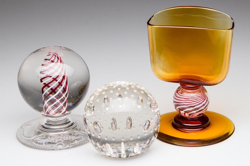 ASSORTED PAIRPOINT ARTICLES, LOT OF THREE: ASSORTED PAIRPOINT ARTICLES, LOT OF THREE, comprising a candy-tripe swirl paperweight raised on an engraved base, a controlled bubble paperweight, and a cigarette holder with candy-stripe stem, each w