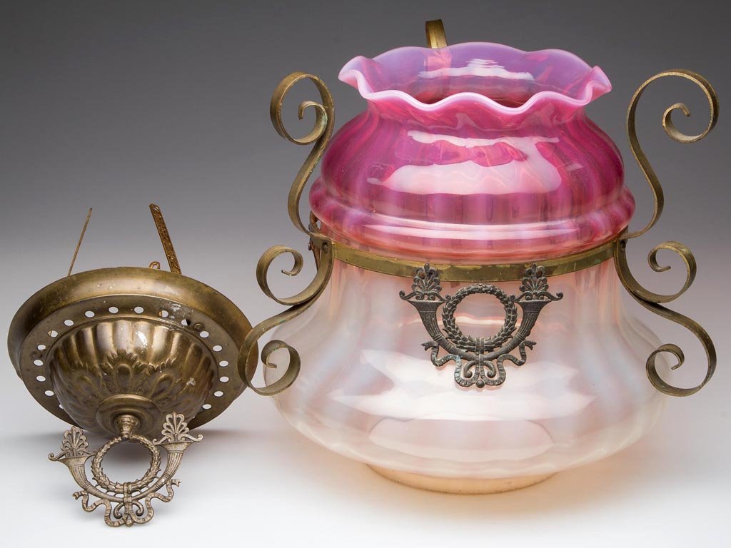 VICTORIAN RIB-OPTIC HANGING HALL LIGHT: VICTORIAN RIB-OPTIC HANGING HALL LIGHT, rubina opalescent, with original fitted brass shade frame and font holder, lacking hanging chains and ceiling mount. Fourth quarter 19th century. 9" H shade, 6"