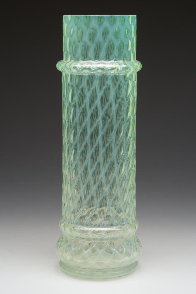 DIAMOND-OPTIC APOTHECARY / STRAW JAR BASE: DIAMOND-OPTIC APOTHECARY / STRAW JAR BASE, pale vaseline (uranium) opalescent, bulge base, factory polished rim. Late 19th/early 20th century. 11 1/2" H, 3 5/8" D base. Provenance: From the collection
