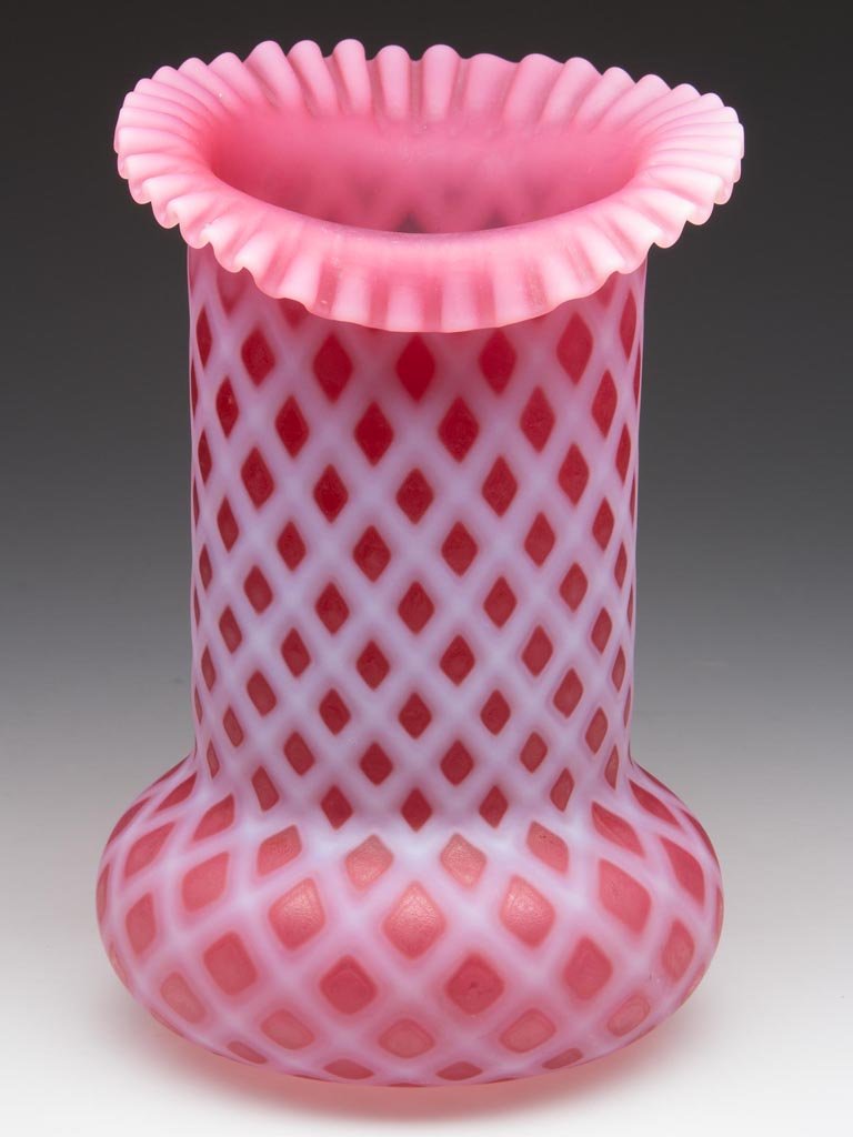 LATTICE VASE: LATTICE VASE, cranberry opalescent with satin finish, bulge base with circular tightly crimped rim. 20th century. 7" HOA. Provenance: From the collection of Larry & Diana Nellans.