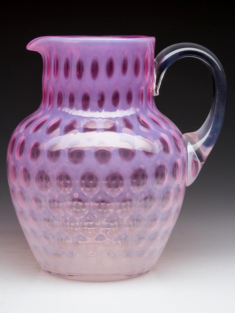 WINDOWS WATER PITCHER: WINDOWS WATER PITCHER, shaded cranberry opalescent, shouldered form with short cylindrical neck, plain rim, colorless, applied handle, and polished pontil mark. Fourth quarter 19th century. 8" H, 3 3/