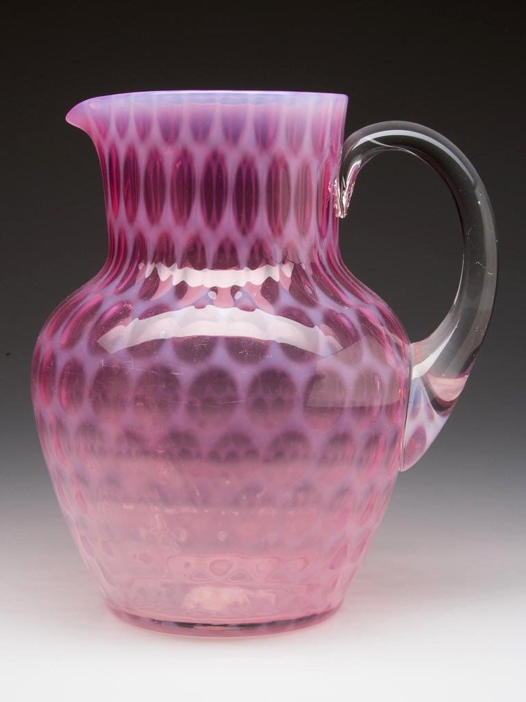 WINDOWS WATER PITCHER: WINDOWS WATER PITCHER, cranberry with light opalescence, shouldered form, with plain rim, colorless applied handle, and polished pontil mark. Fourth quarter 19th century. 8 1/2" HOA. Provenance: From 