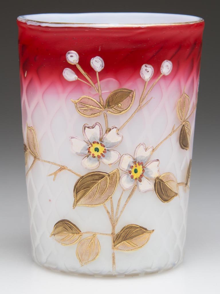 DIAMOND QUILT AIR-TRAP MOTHER-OF-PEARL SATIN GLASS: DIAMOND QUILT AIR-TRAP MOTHER-OF-PEARL SATIN GLASS TUMBLER, rubina, polychrome-enamel and gilt floral decoration, ground pontil mark. Possibly Phoenix Glass Co. Fourth quarter 19th century. 3 3/4" H. 