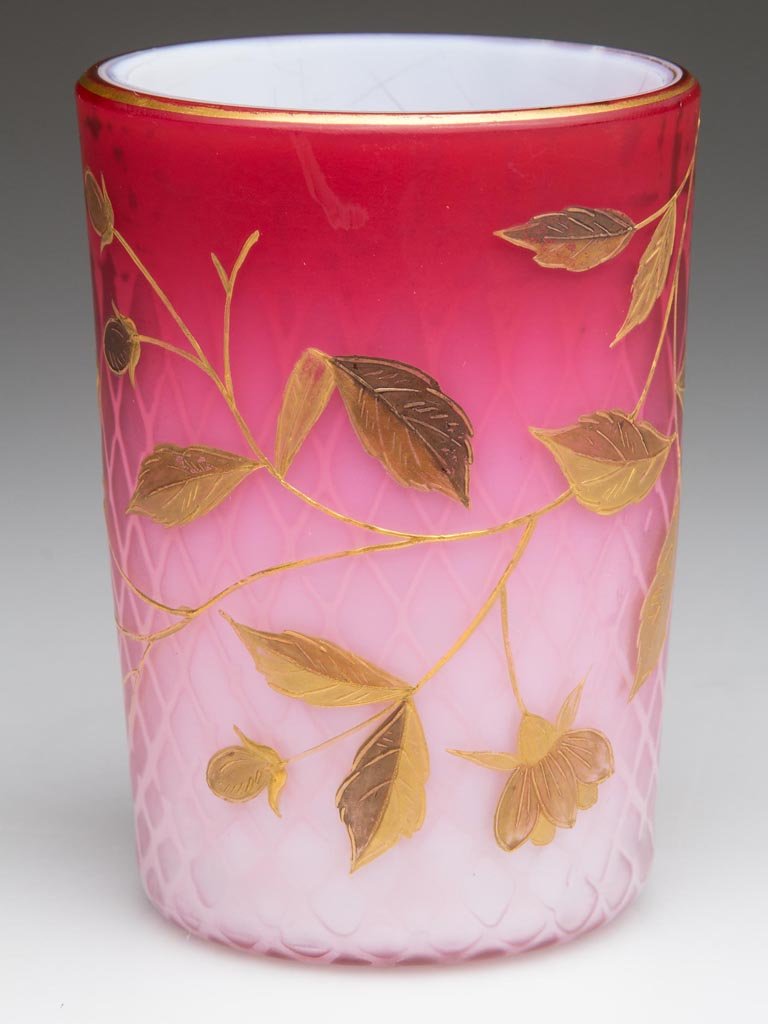 DIAMOND QUILT AIR-TRAP MOTHER-OF-PEARL SATIN GLASS: DIAMOND QUILT AIR-TRAP MOTHER-OF-PEARL SATIN GLASS TUMBLER, shaded rose, well executed two-tone gilt floral decoration, rough pontil mark. Fourth quarter 19th century. 3 3/4" H. Provenance: Property o