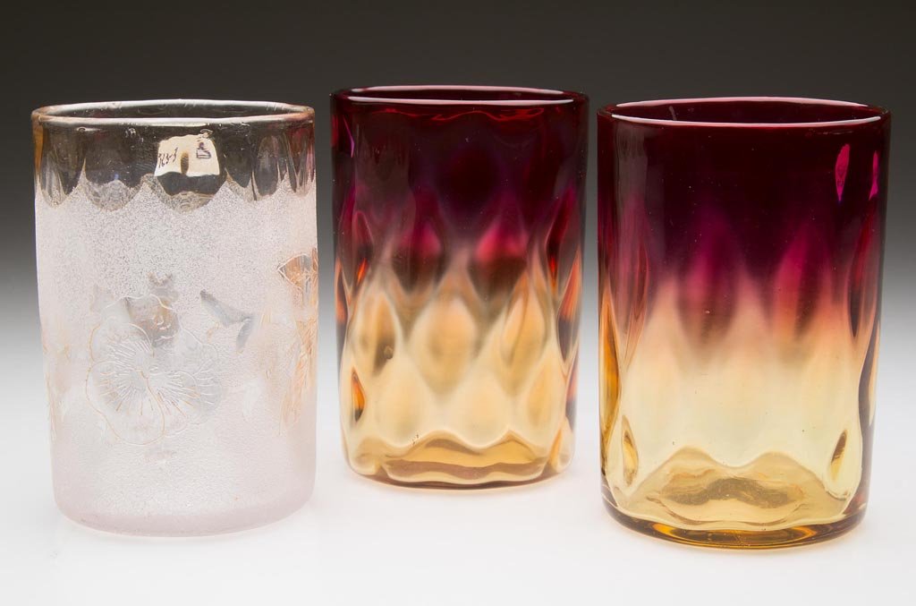 DIAMOND-OPTIC TUMBLERS, LOT OF THREE: DIAMOND-OPTIC TUMBLERS, LOT OF THREE, comprising two amberina, one with a fuchsia rim, and a second patent etching Pomona with Pansy and Butterfly decoration, each with polished pontil mark. New Engla