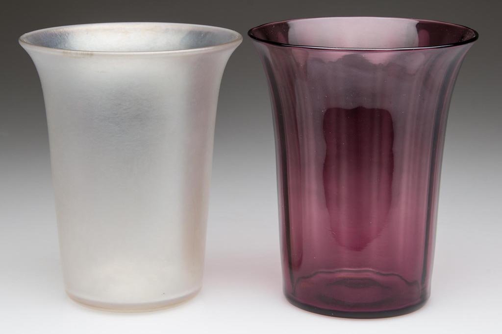 STEUBEN TUMBLERS, LOT OF TWO: STEUBEN TUMBLERS, LOT OF TWO, shape 1044, comprising an Amethyst Rib-Optic and a Verre de Soie unpatterned, each with polished pontil mark, not signed. Steuben Glass Works. First quarter 20th century.