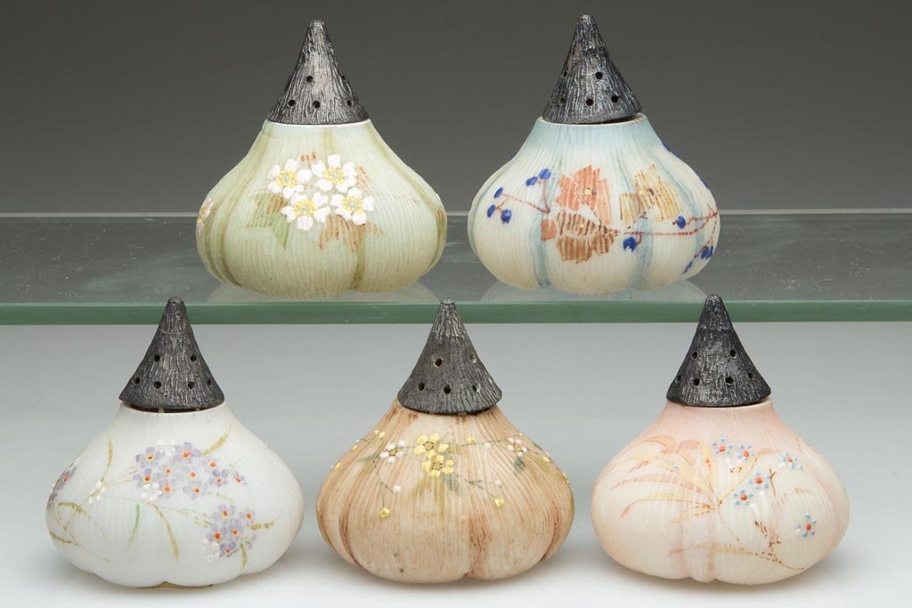 ASSORTED MT. WASHINGTON FIG / BEET (OMN) SALT SHAKERS,: ASSORTED MT. WASHINGTON FIG / BEET (OMN) SALT SHAKERS, LOT OF FIVE, opal with various grounds, plush/satin finish, each with polychrome floral decoration and period lids. Mt. Washington Glass Co. Four