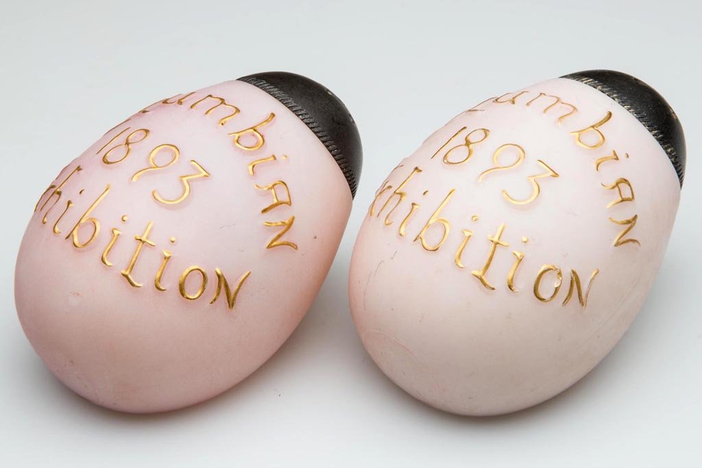 MT. WASHINGTON / SMITH BROTHERS EGG - FLAT-SIDE PAIR OF: MT. WASHINGTON / SMITH BROTHERS EGG - FLAT-SIDE PAIR OF SALT AND PEPPER SHAKERS, opal, with pale rose ground with plush/satin finish, embossed and gilt highlighted "Columbian 1893 Exhibition". Each st