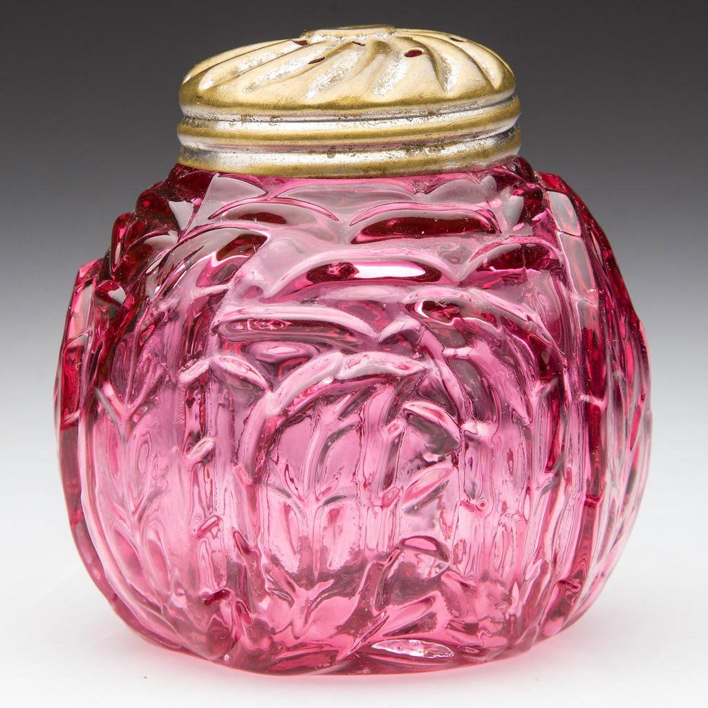 NORTHWOOD NO. 333 / LEAF MOLD SALT SHAKER: NORTHWOOD NO. 333 / LEAF MOLD SALT SHAKER, ruby, with period lid. Northwood Glass Co. Pattern introduced in 1891. 2 1/2" HOA. Provenance: From a Washington state private collection.