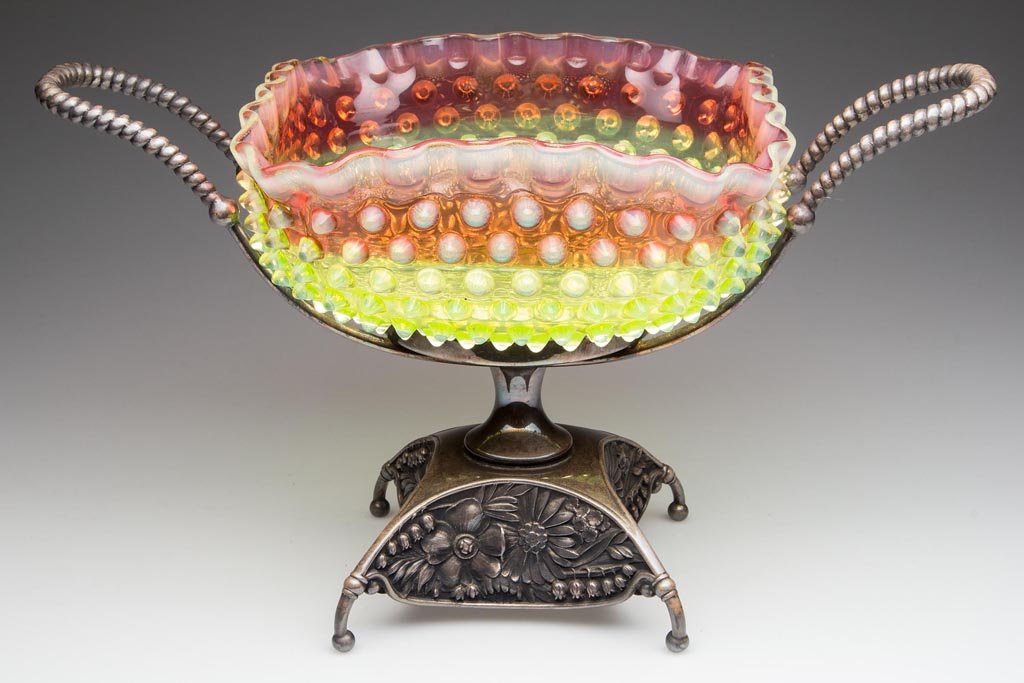 HOBBS NO. 323 DEW DROP / HOBNAIL BRIDE'S BASKET: HOBBS NO. 323 DEW DROP / HOBNAIL BRIDE'S BASKET, rubina verde (uranium) square bowl, ruffled rim and polished pontil mark. Fitted in a quadruple-plate stand marked for the Pairpoint Mfg. Co. and numbe