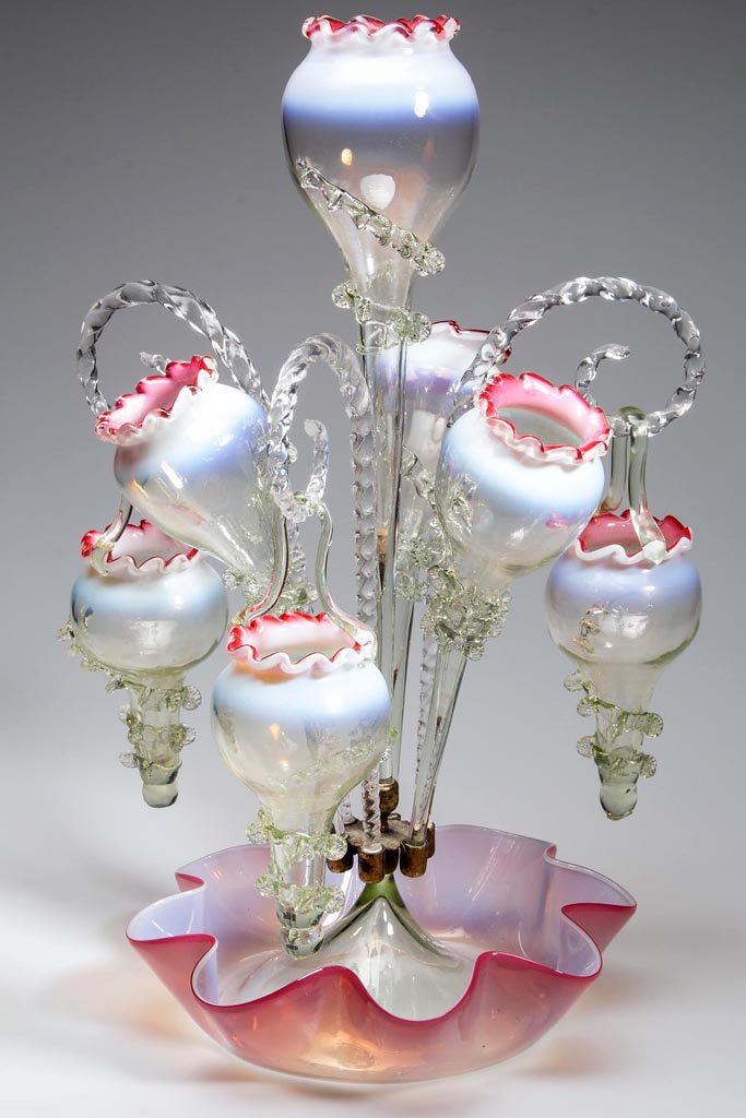 VICTORIAN GLASS EPERGNE: VICTORIAN GLASS EPERGNE, cranberry opalescent to pale green, ruffle-edge bowl supporting a central floriform vase with applied rigaree, centering three matching vases alternating with twisted shepherd