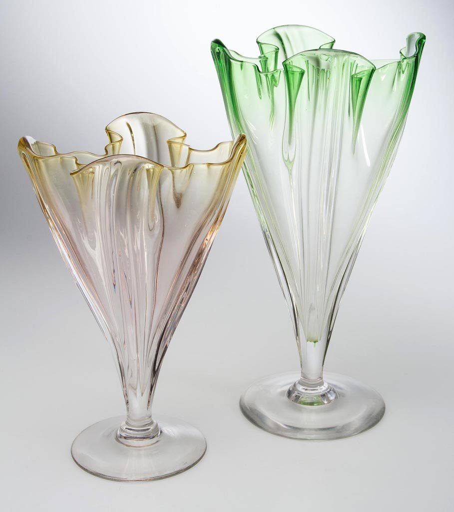 STEUBEN GROTESQUE VASES, LOT OF TWO: STEUBEN GROTESQUE VASES, LOT OF TWO, green to colorless and yellow amber to colorless, shape 7090, each with polished pontil mark, not signed. Steuben Glass Works. Second quarter 20th century. 11 1/4"