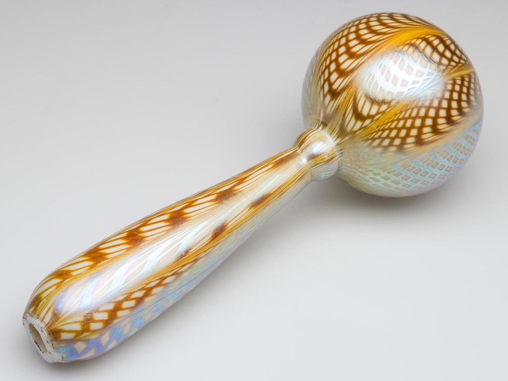 STEUBEN DECORATED CALCITE DARNING BALL: STEUBEN DECORATED CALCITE DARNING BALL, gold Aurene decoration, rough open pontil end, not signed. Steuben Glass Works. Circa 1916. 6 1/2" L. Literature: Dimitroff - Frederick Carder and Steuben Glass