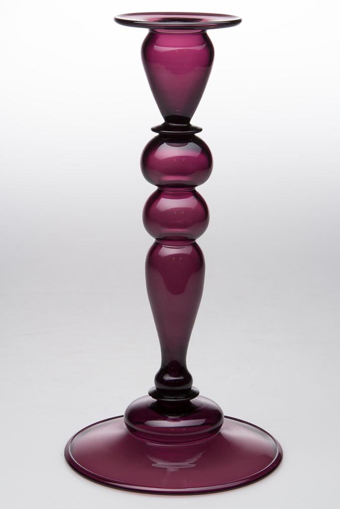STEUBEN CANDLESTICK: STEUBEN CANDLESTICK, Amethyst, shape 2956, double-knop hollow stem, folded foot with rough pontil mark, not signed. Steuben Glass Works. Circa 1925. 10" H. Provenance: From a Midwestern estate collect