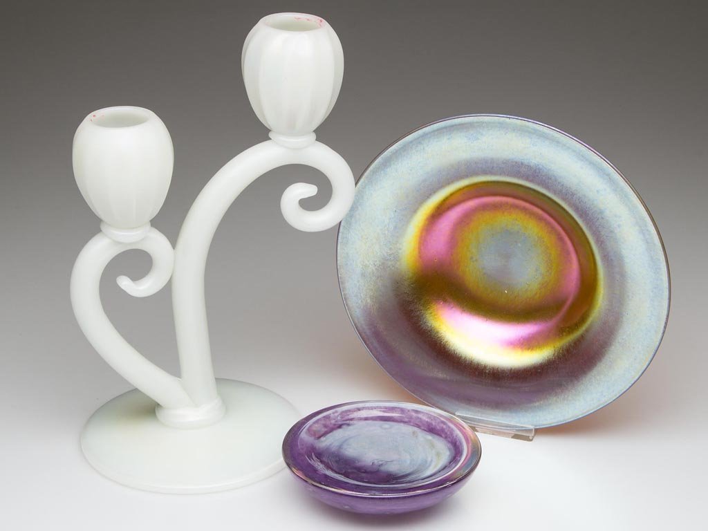 ASSORTED STEUBEN ARTICLES, LOT OF TWO: ASSORTED STEUBEN ARTICLES, LOT OF TWO, comprising an Ivrene shape 7563 candlestick and a Gold Aurene shape 2361 underplate, both signed. Together with a purple Cluthra-style coaster. Steuben Glass Wor