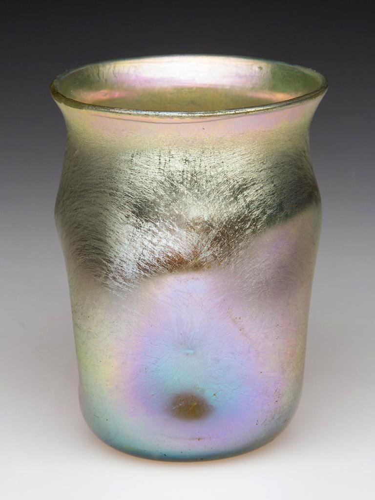 TIFFANY FAVRILE SMALL TUMBLER / MATCH HOLDER: TIFFANY FAVRILE SMALL TUMBLER / MATCH HOLDER, gold iridescent, square pinched-side body, signed "L.C.T." around the polished pontil mark. Louis Comfort Tiffany & Co. First quarter 20th century. 2 3/4"
