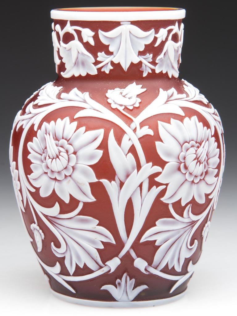 WEBB ENGLISH CAMEO CABINET VASE: WEBB ENGLISH CAMEO CABINET VASE, white to deep red, fully carved with flowers and scrolls, factory polished rim, table ring and concave base. Thomas Webb & Sons. Fourth quarter 19th century. 4" H. Pro