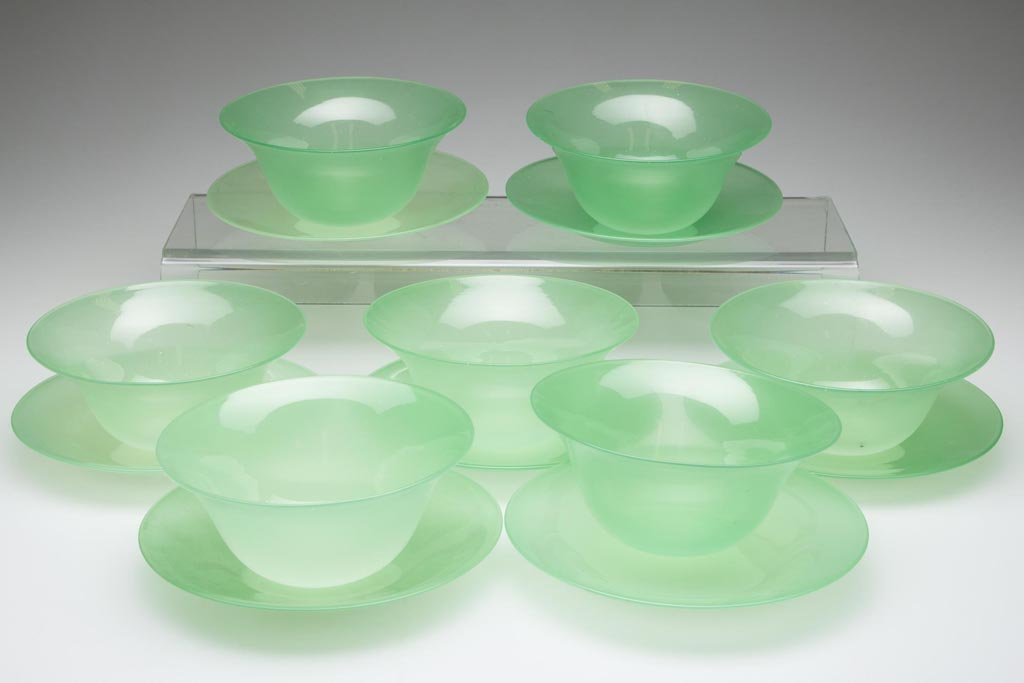 STEVENS AND WILLIAMS FINGER BOWLS AND UNDERPLATES, SET: STEVENS AND WILLIAMS FINGER BOWLS AND UNDERPLATES, SET OF SEVEN, green jade, each with polished pontil mark, several with acid-stamped mark. First half 20th century. 5" to 5 3/4" D. Provenance: From a