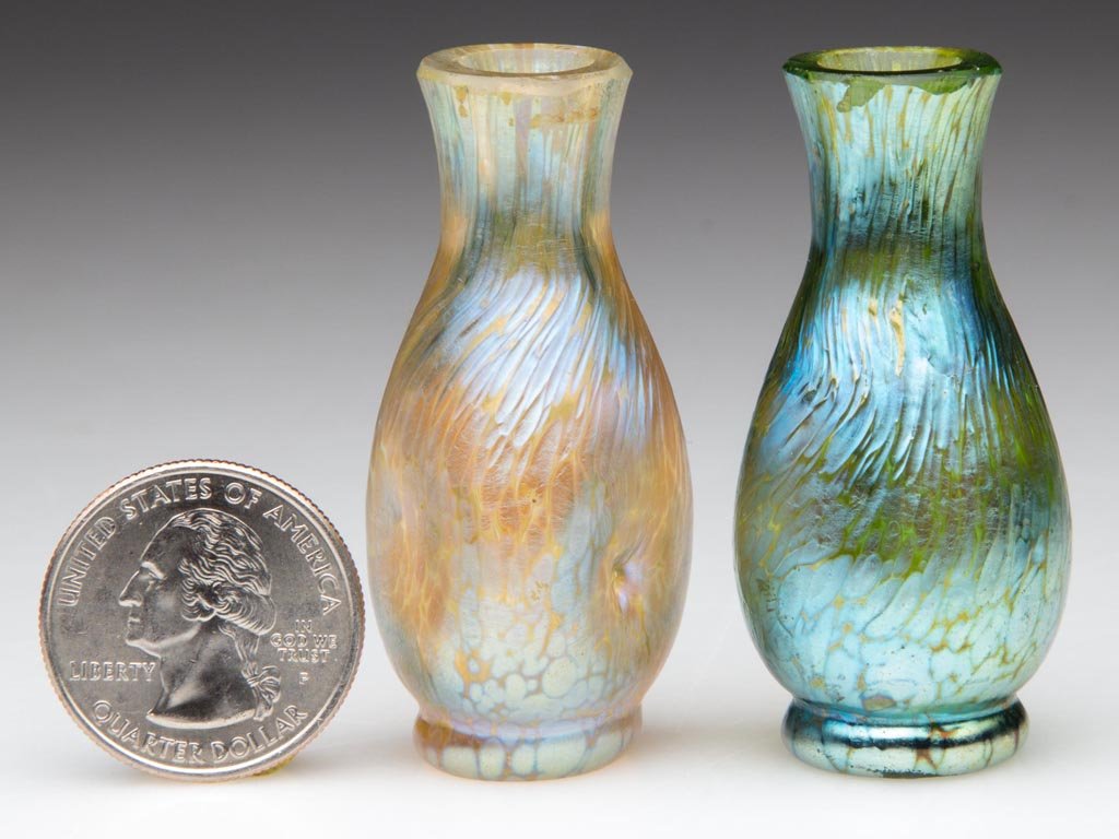 LOETZ PAPILLON MINIATURE VASES, LOT OF TWO: LOETZ PAPILLON MINIATURE VASES, LOT OF TWO, Crete and Candia, each of baluster form, one with pinched sides, each with factory polished mouth and base. Bohemia. Circa 1900. 2" H. Provenance: From a Ne