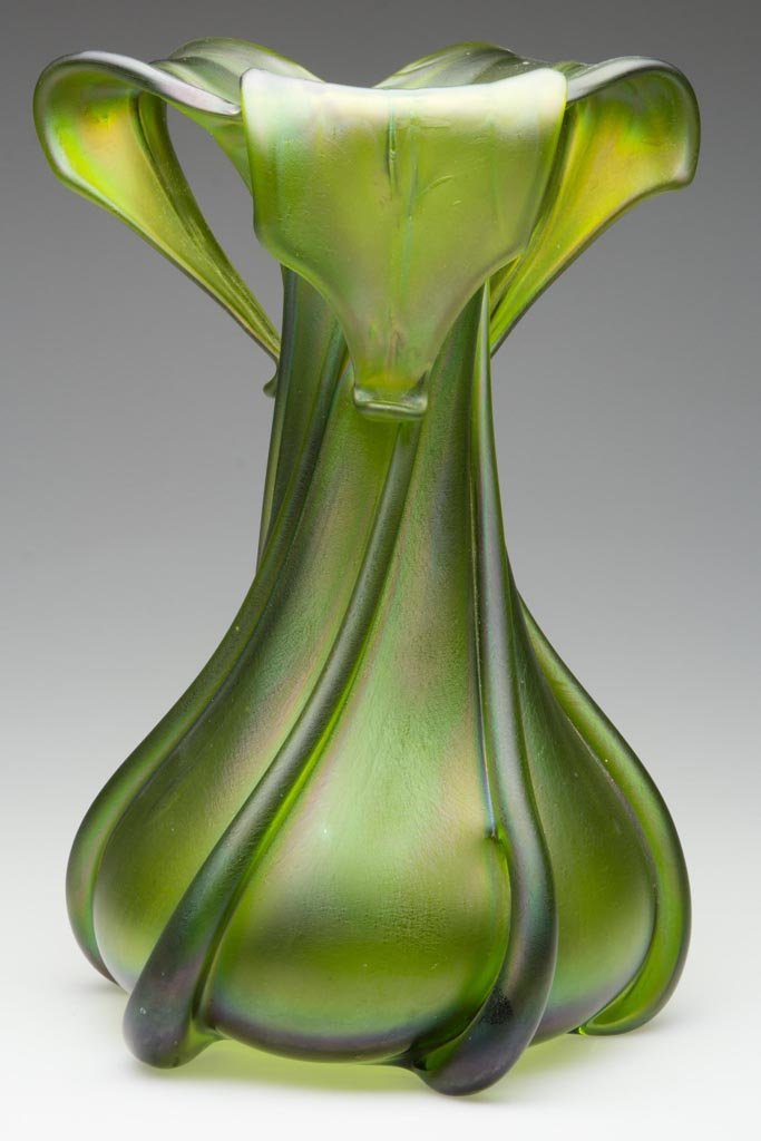 LOETZ-TYPE GLATT PILLAR-DECORATED VASE: LOETZ-TYPE GLATT PILLAR-DECORATED VASE, Crete, six heavy swirling pillars/ribs terminating in a cut and folded tri-part rim, polished pontil mark. Bohemia. Late 19th/early 20th century. 12 1/4" H.