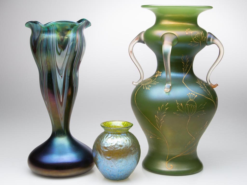 LOETZ-TYPE BOHEMIAN VASES, LOT OF THREE: LOETZ-TYPE BOHEMIAN VASES, LOT OF THREE, comprising a teal iridescent example with polychrome decoration pulled from the rim, and two green iridescent examples, one with applied handles and enamel dec