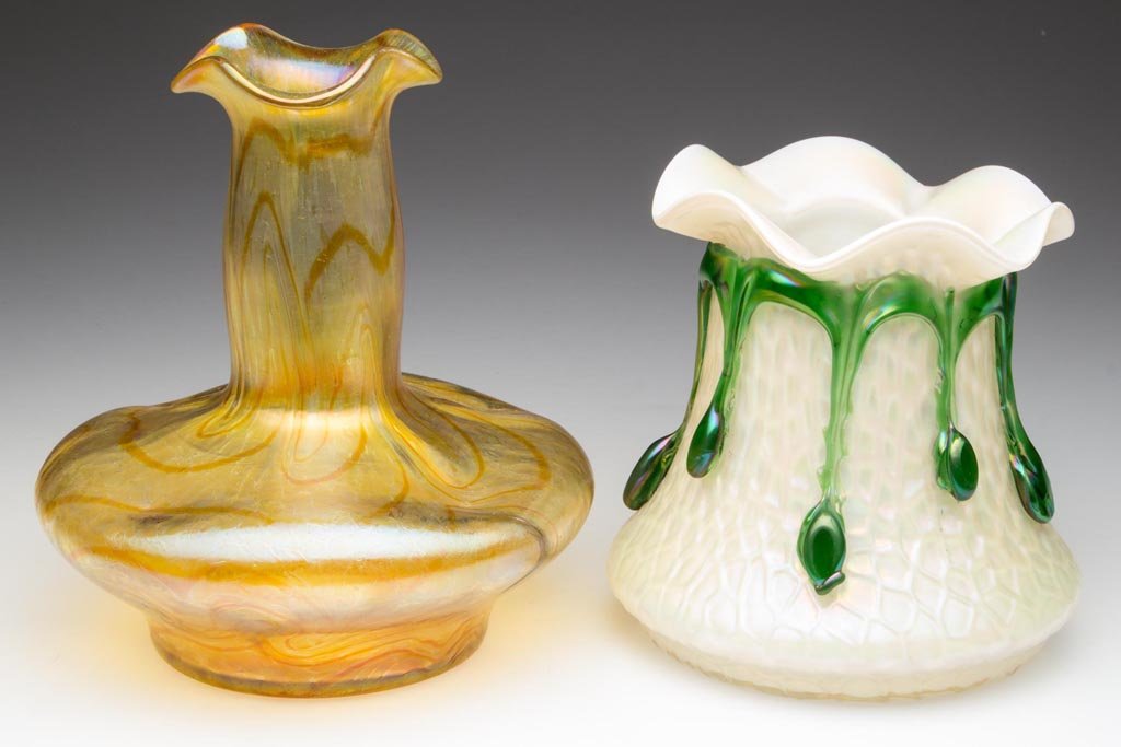 LOETZ-TYPE BOHEMIAN VASES, LOT OF TWO: LOETZ-TYPE BOHEMIAN VASES, LOT OF TWO, comprising a translucent iridescent opal example with textured surface and applied green tassels, and a gold iridescent example with random orange swirls, each w