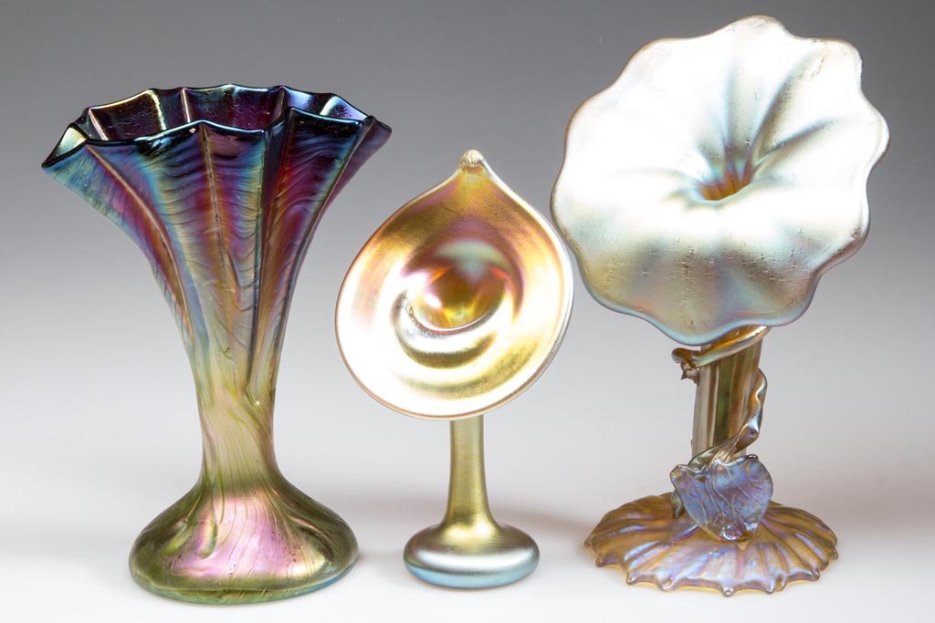 LOETZ-TYPE BOHEMIAN VASES, LOT OF TWO: LOETZ-TYPE BOHEMIAN VASES, LOT OF TWO, comprising a gold iridescent Jack-in-the-Pulpit example with applied foliage to stem, and a ruby shaded to green iridescent example with swirled surface and Loet