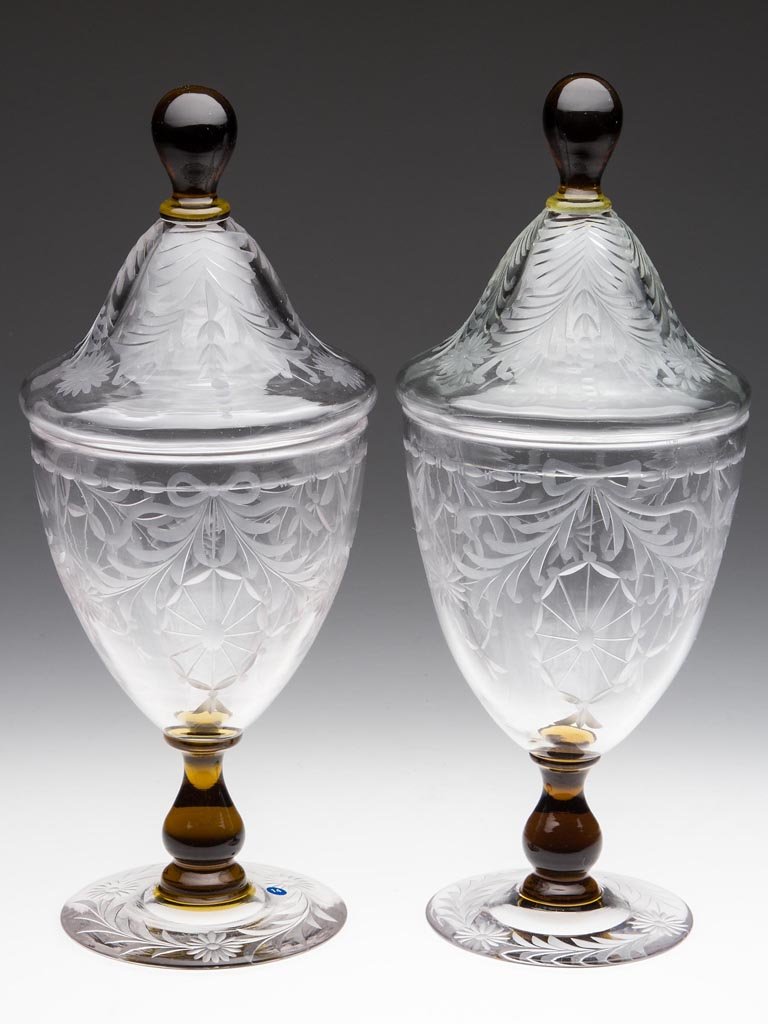 PAIRPOINT "WATERFORD" ENGRAVED PAIR OF COVERED URNS: PAIRPOINT "WATERFORD" ENGRAVED PAIR OF COVERED URNS, colorless and amber, shape A-292, each with polished pontil mark. Pairpoint Corporation, New Bedford, MA. Circa 1925. 10" HOA, 6 1/4" H urn. Proven